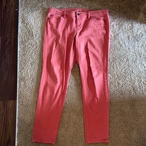 Dark rose colored skinny jeans.